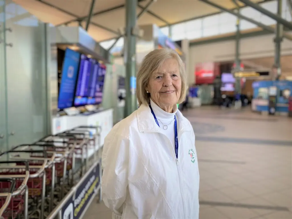 Photo of Elke in a white shirt, the uniform of the “Wild Rose Brigade.”