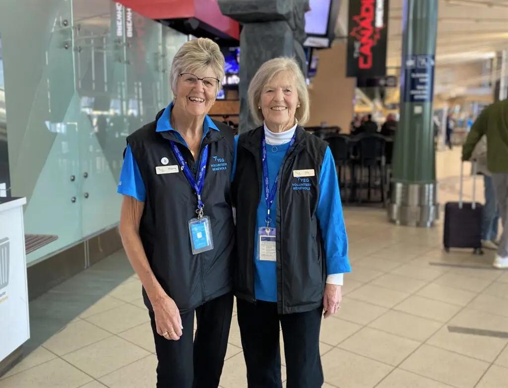 Photo of Elke and Maxine standing by The Canadian Brewhouse.