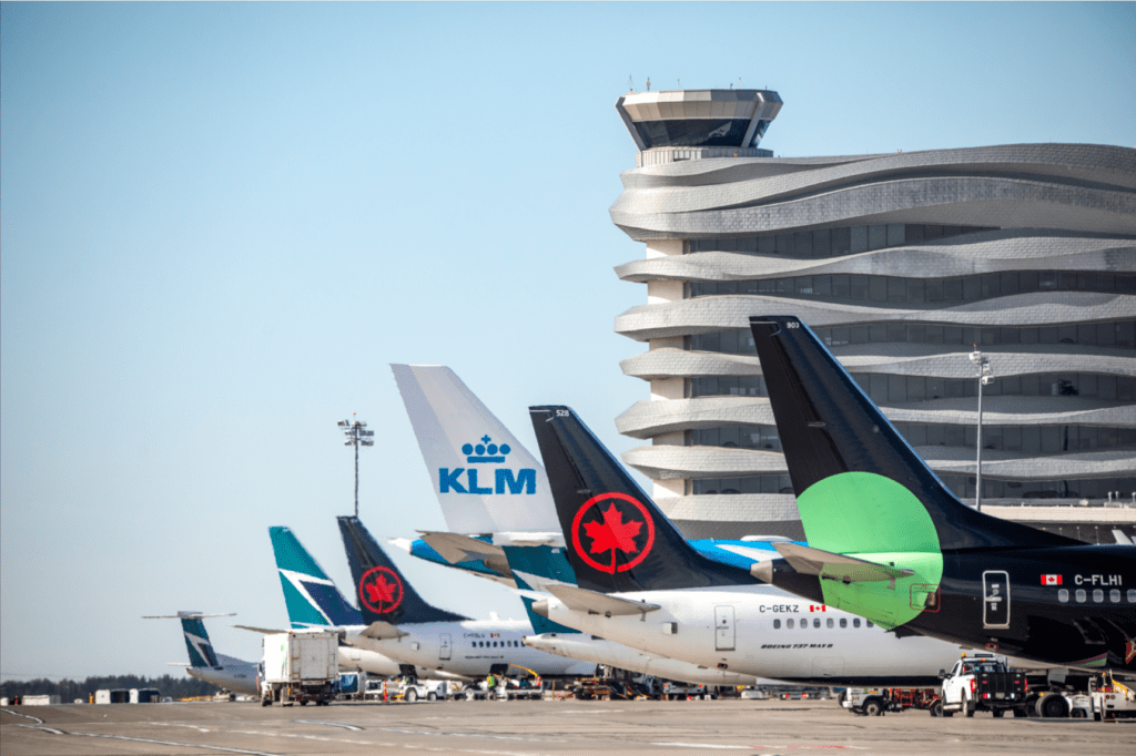 Photos of planes parked in front of YEG tower