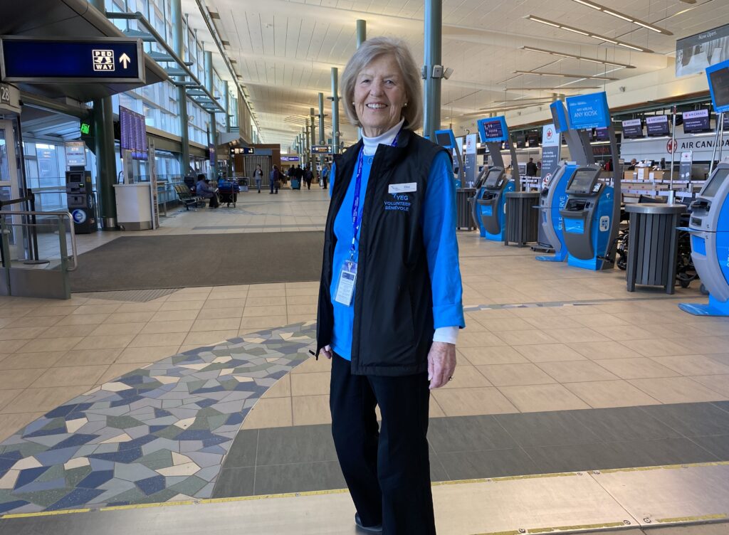 Volunteer Elke Valentin standing in the terminal