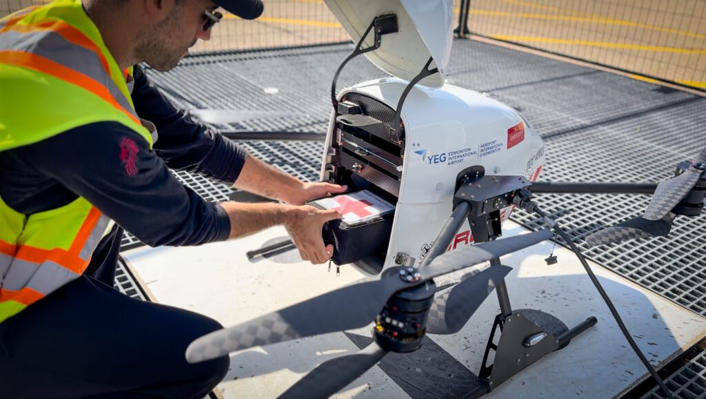 Photo of a drone operator working on a drone